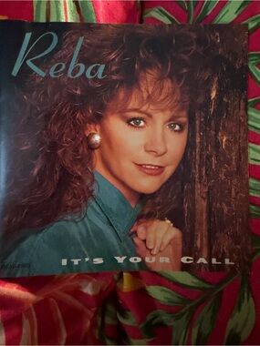 Reba Teal Jacket Album Cover with Brown Wood Background